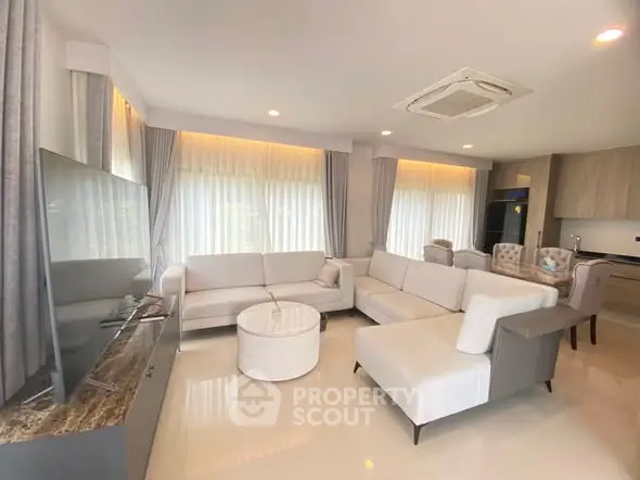 Spacious modern living room with elegant furniture and natural light