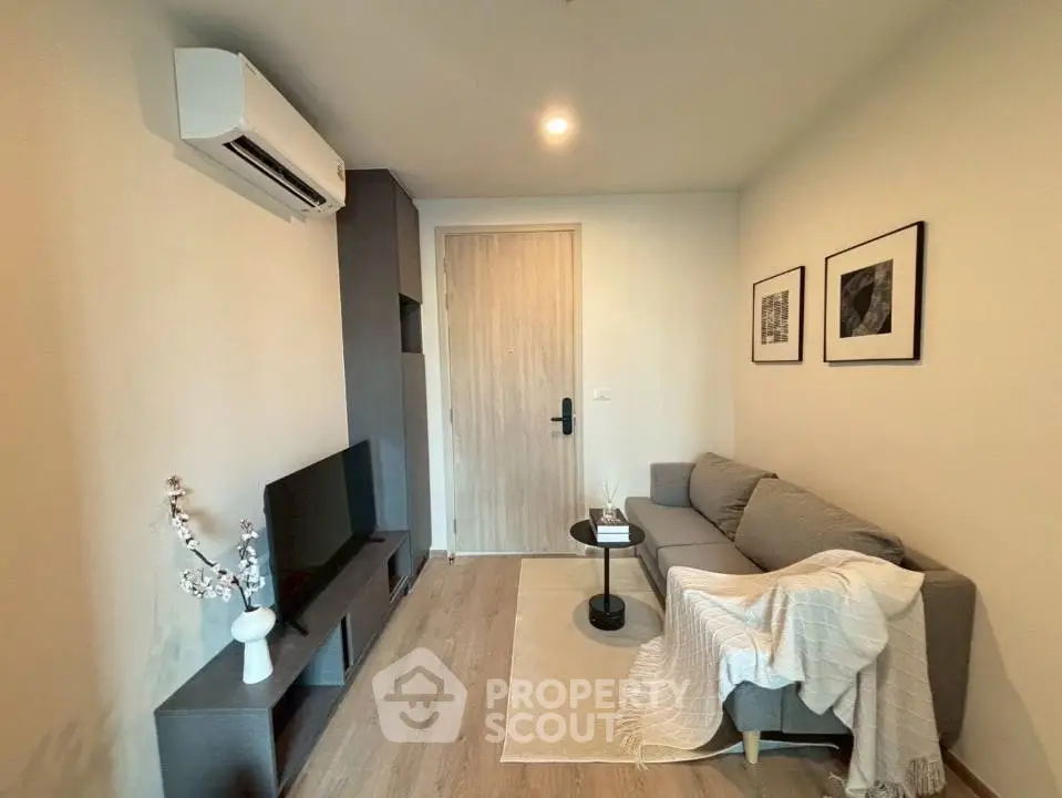 Cozy modern living room with stylish decor and air conditioning