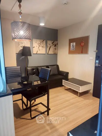 Modern living room with stylish decor and cozy seating area, perfect for relaxation and entertaining.