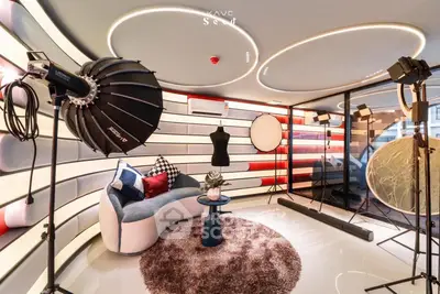 Stylish modern living room with unique lighting and chic decor, perfect for urban living.