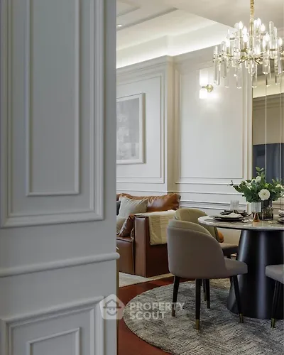 Elegant living room with modern chandelier and stylish furniture