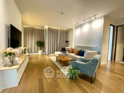 Spacious modern living room with elegant decor and wooden flooring