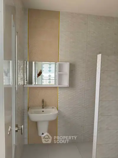 Modern bathroom with stylish tiles and sleek sink design