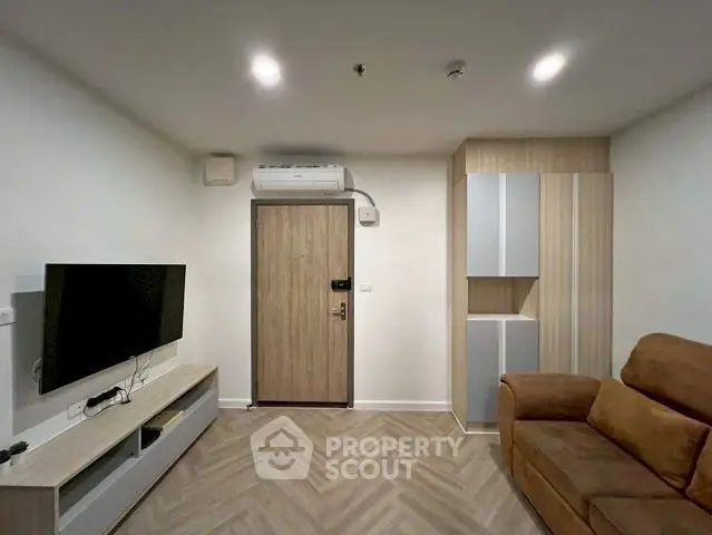 Modern living room with sleek furniture and stylish wood flooring