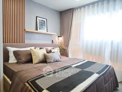Modern bedroom with stylish decor and natural light