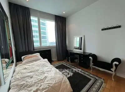 Modern bedroom with elegant decor and city view window