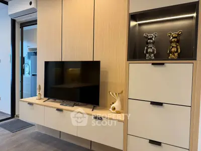 Modern living room with sleek cabinetry and stylish decor in a contemporary apartment.