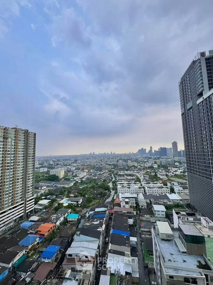 Stunning cityscape view from high-rise building showcasing urban skyline and residential areas.