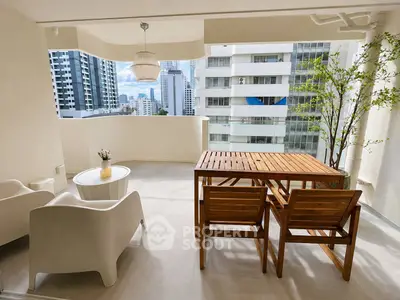 Spacious balcony with modern furniture and city view, perfect for relaxation and entertaining.