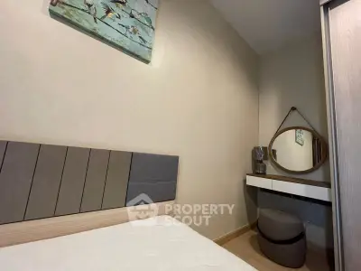 Cozy bedroom with modern decor and stylish mirror