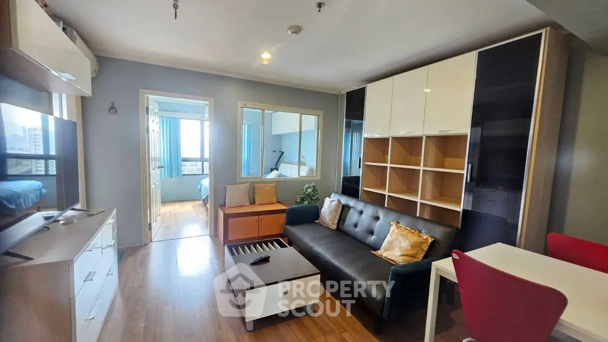 Modern living room with sleek furniture and open layout in urban apartment