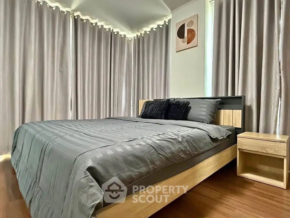 Modern bedroom with stylish decor and natural light