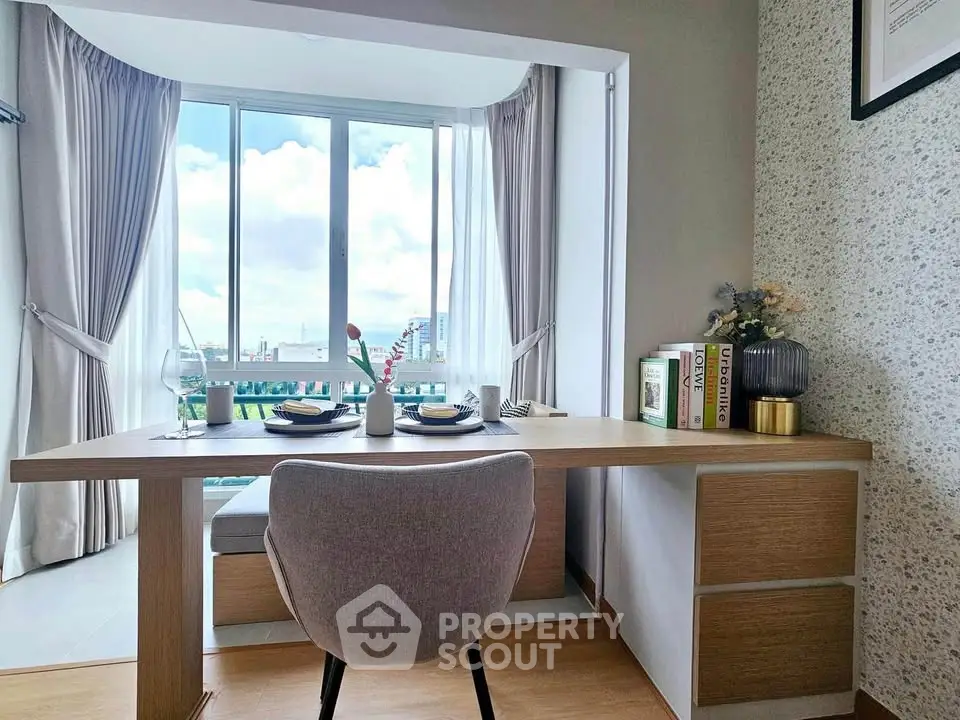 Modern study area with a scenic view, featuring a sleek desk and comfortable chair, perfect for productivity.