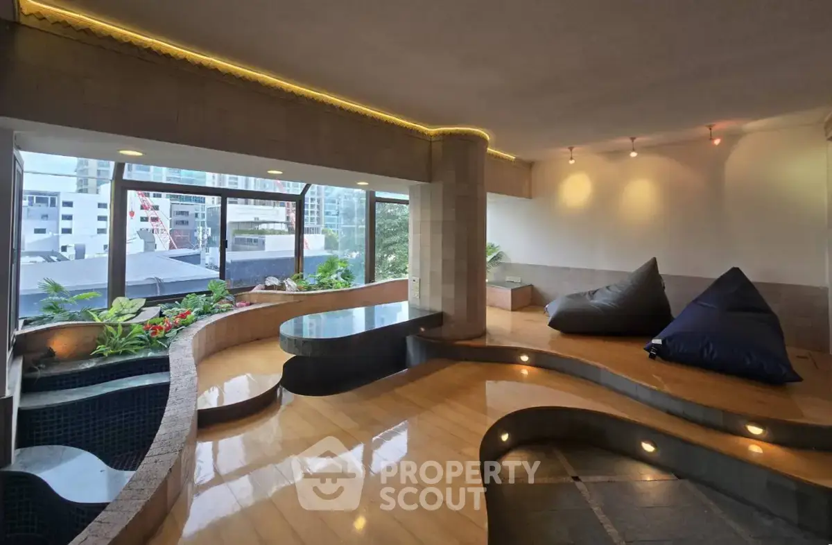 Luxurious indoor space with modern design and city view, featuring cozy seating and elegant lighting.