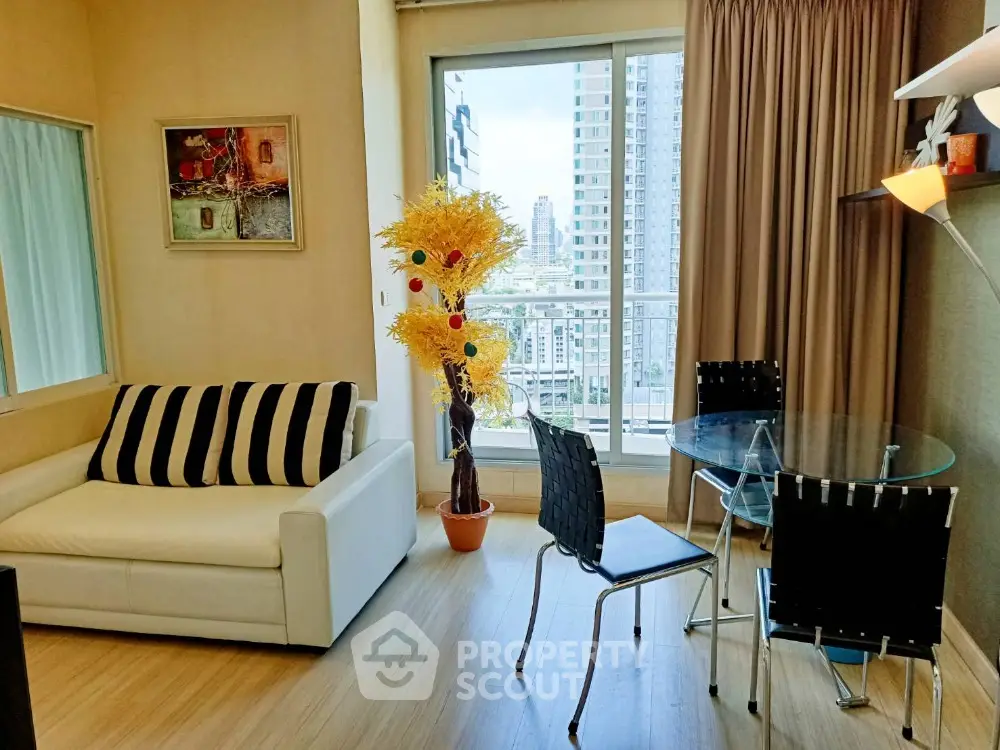 Modern living room with city view, stylish furniture, and natural light