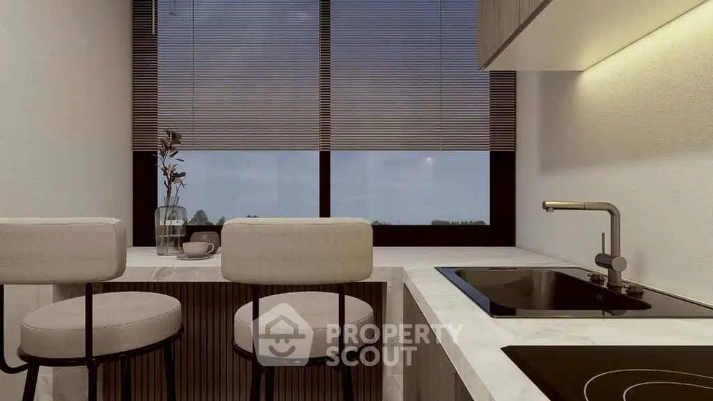 Modern kitchen with sleek design and large window view