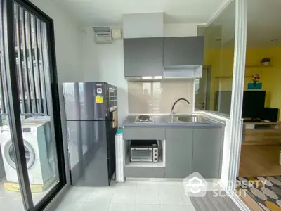 Modern compact kitchen with sleek appliances and open layout