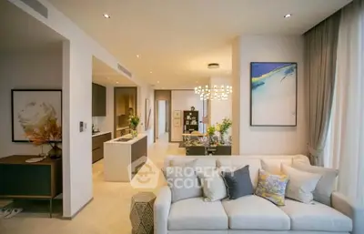 Luxurious open-plan living room with modern kitchen and elegant decor