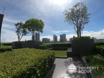 Stunning rooftop garden with city skyline views and lush greenery.