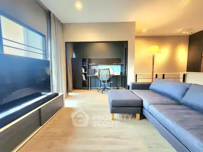 Modern living room with sleek furniture and cozy study nook