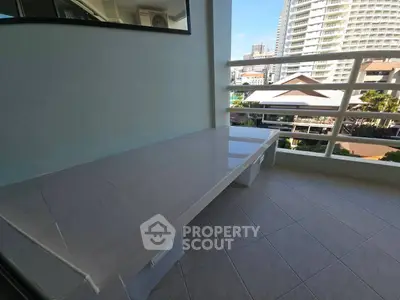 Spacious balcony with city view, perfect for relaxation and enjoying the urban skyline.