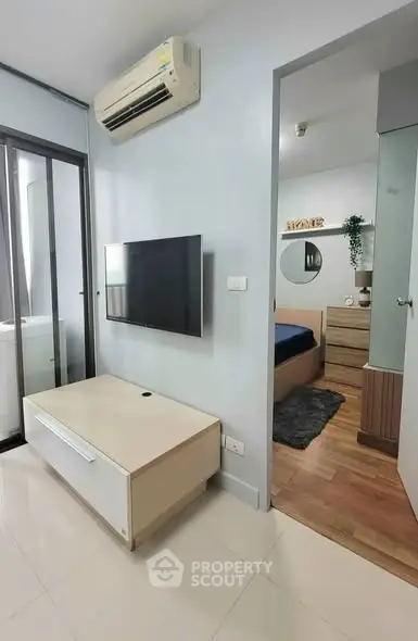 Modern apartment interior with sleek living room and cozy bedroom view