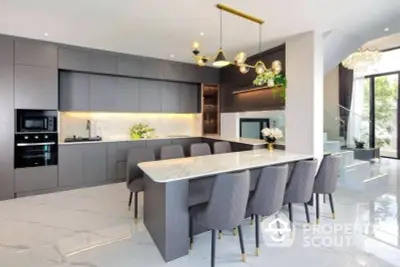 Luxurious modern kitchen with sleek design and elegant dining area