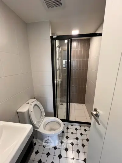 Modern bathroom with sleek shower and stylish tile flooring