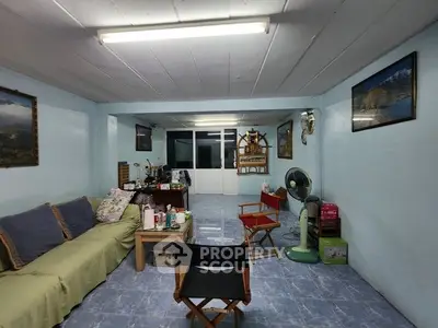 Cozy living room with comfortable seating and unique decor in a well-lit space.