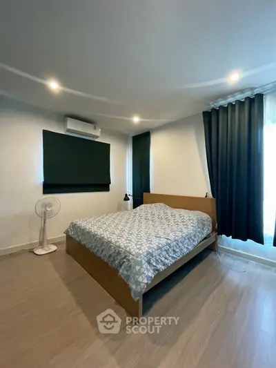 Cozy bedroom with modern decor and natural light