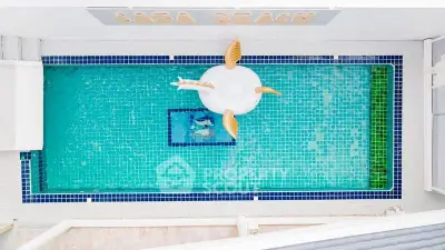 Stunning aerial view of a luxurious private pool with unique float, perfect for relaxation.