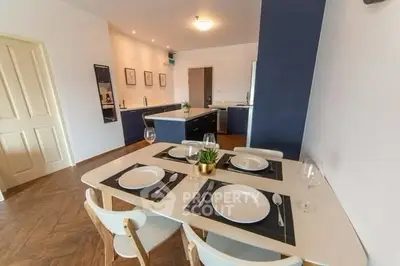 Modern dining area with elegant table setting and stylish kitchen in open layout