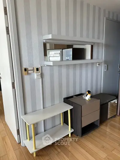 Modern interior with stylish shelving and wooden flooring in a contemporary apartment.