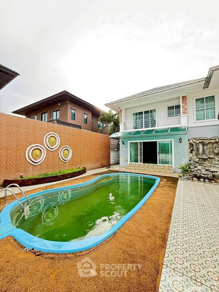 Charming two-story house with private pool and spacious patio, perfect for family gatherings and relaxation.