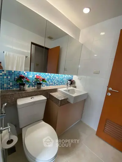 Modern bathroom with stylish mosaic tiles and sleek fixtures