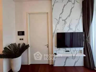 Modern living room with wall-mounted TV and stylish decor