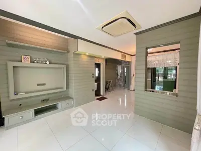 Spacious living room with modern design and built-in entertainment unit