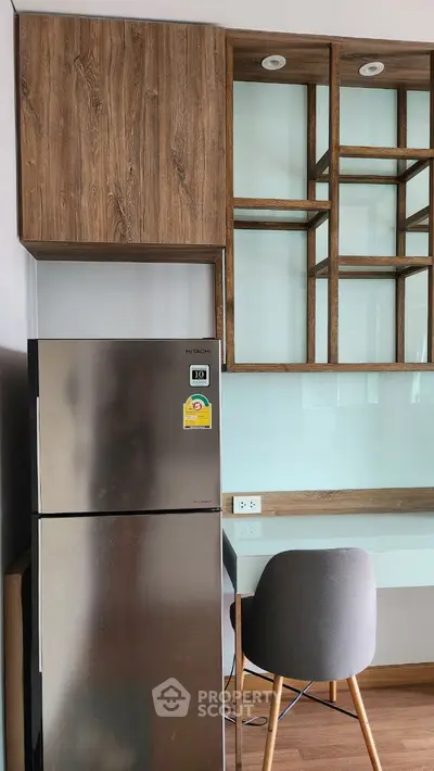 Modern kitchen with stainless steel fridge and wooden cabinetry