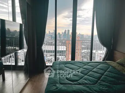 Luxurious bedroom with stunning city view and floor-to-ceiling windows.
