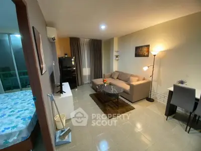 Modern living room with cozy sofa and stylish decor in open layout apartment.