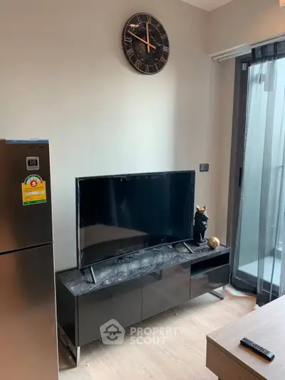 Modern living room with sleek TV stand and balcony view