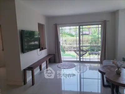 Spacious living room with garden view and modern decor