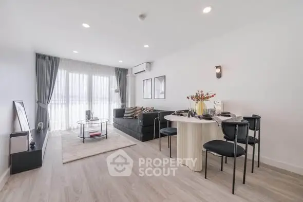 Spacious modern living room with elegant decor and natural light
