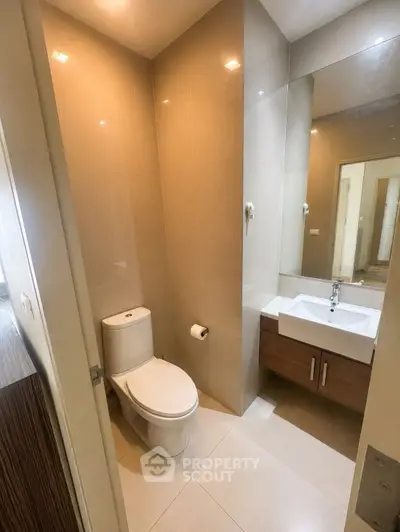 Modern bathroom with sleek fixtures and elegant design in a contemporary apartment.