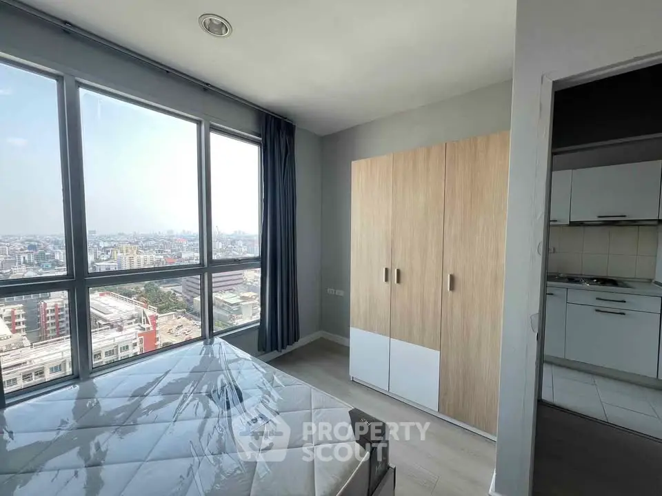 Modern bedroom with city view and sleek wardrobe