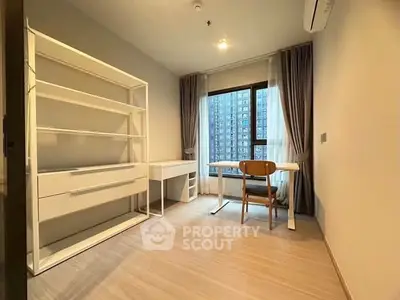 Modern study room with large window and city view, featuring minimalist furniture and ample natural light.