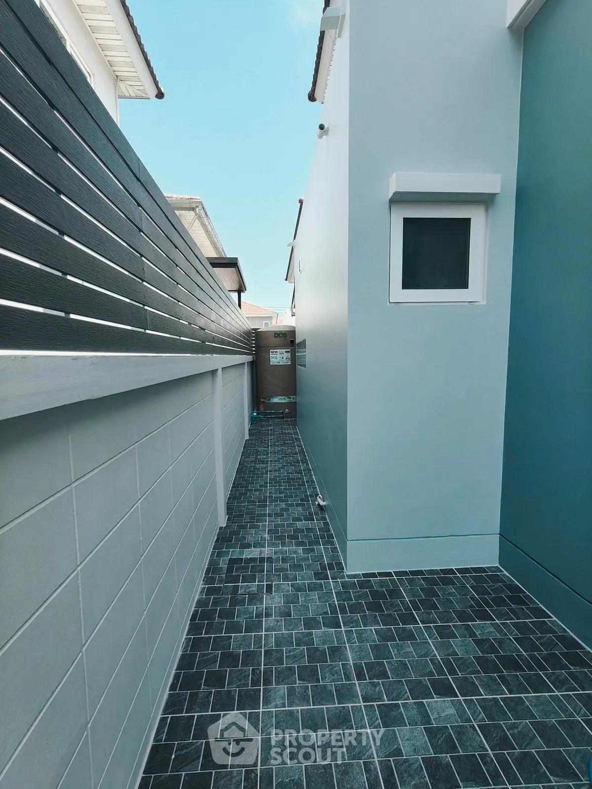 Modern exterior walkway with sleek design and stylish tiles in a contemporary home setting.