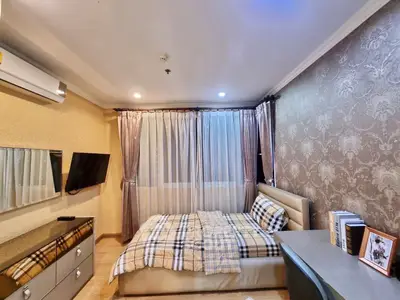 Elegant bedroom with stylish decor and modern amenities