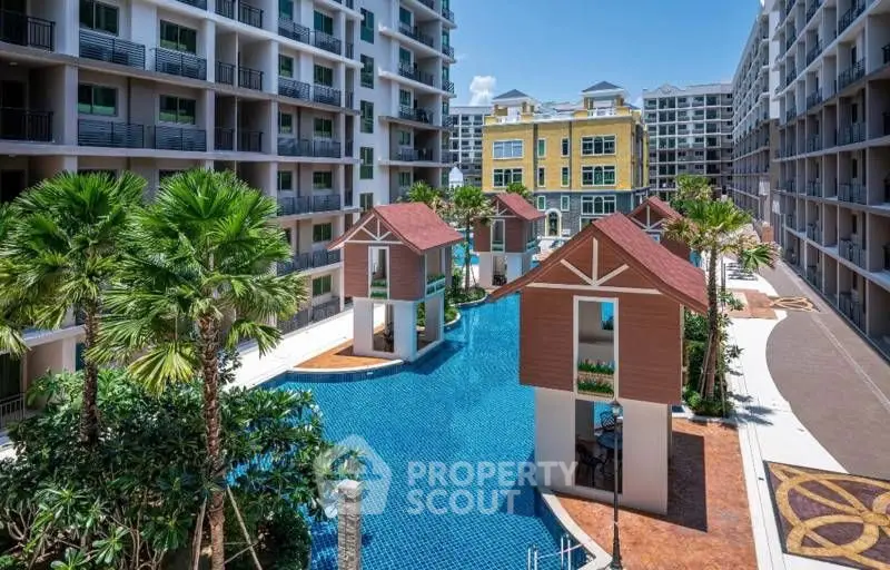 Luxurious apartment complex with stunning pool and tropical landscaping