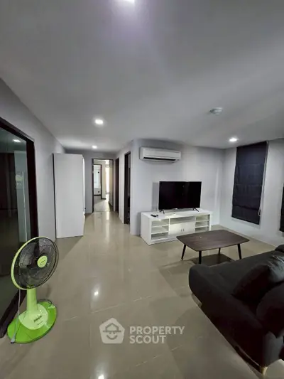 Spacious modern living room with sleek design and natural light